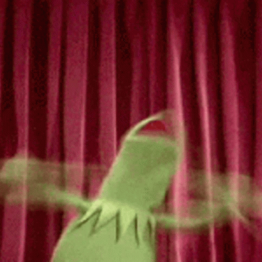 Kermit the Frog flailing his arms and screaming in front of a red curtain