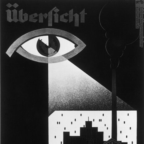 An ad for Dehomag in the 1930s. Black background. A white eye in the upper left corner looks down upon a punchcard with a factory or city silhouette superimposed on it. It reads "ubersicht"
